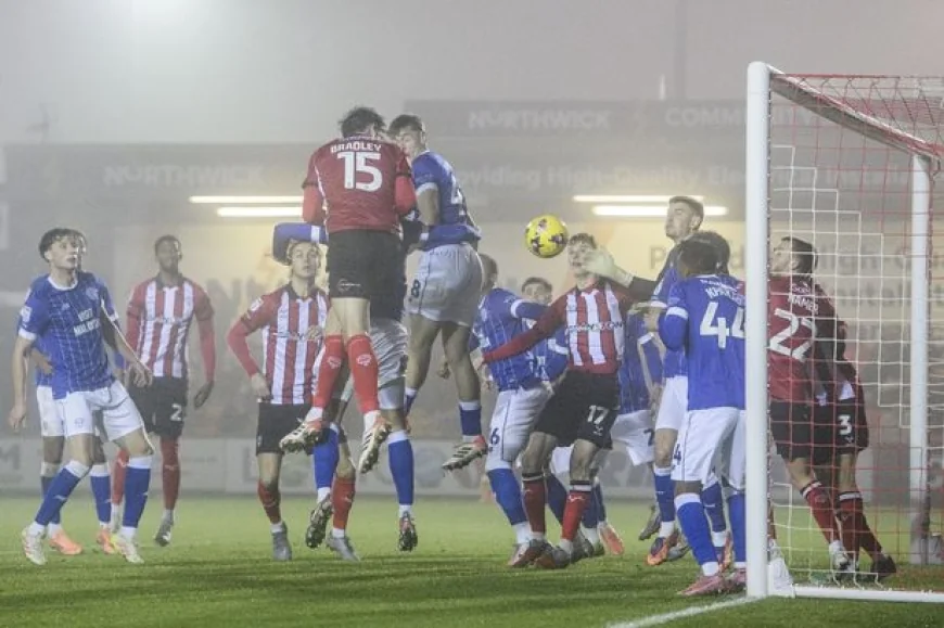 Cardiff remain top despite defeat by Lincoln